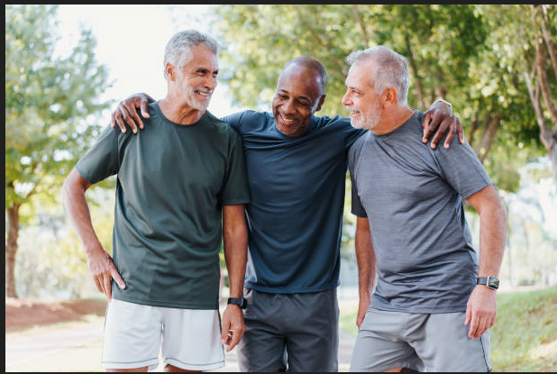 Group of middle-aged men walking outdoors to support prostate health naturally